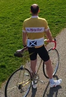 Thomas with his 70-year old Flying Scot and custom jersey to match
