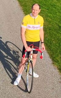 Thomas with his 70-year old Flying Scot and custom jersey to match